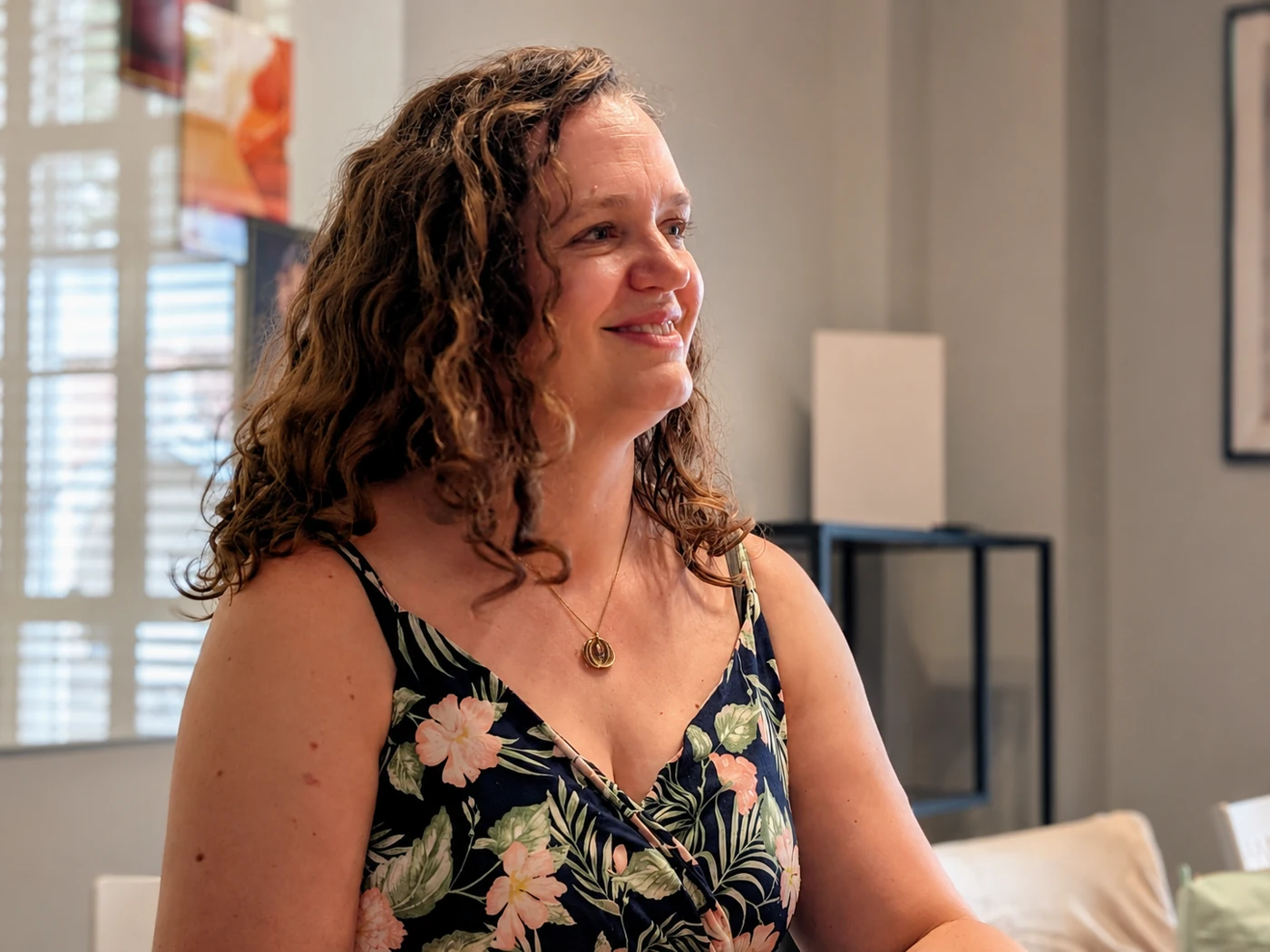 Jen Goddard listening during a conversation in a relaxed setting
