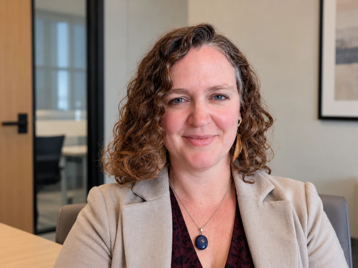 Jen Goddard in a professional meeting room